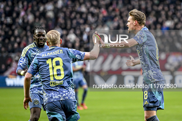 AFC Ajax Amsterdam midfielder Davy Klaassen and AFC Ajax Amsterdam midfielder Kenneth Taylor celebrate the 1-1 goal during the match between...