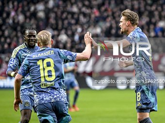 AFC Ajax Amsterdam midfielder Davy Klaassen and AFC Ajax Amsterdam midfielder Kenneth Taylor celebrate the 1-1 goal during the match between...