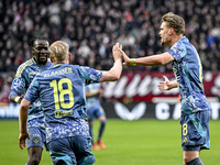 AFC Ajax Amsterdam midfielder Davy Klaassen and AFC Ajax Amsterdam midfielder Kenneth Taylor celebrate the 1-1 goal during the match between...