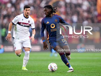 Manu Kone' of AS Roma and Riccardo Orsolini of Bologna FC during the Serie A Enilive match between AS Roma and Bologna FC at Stadio Olimpico...