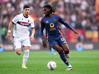 Manu Kone' of AS Roma and Riccardo Orsolini of Bologna FC during the Serie A Enilive match between AS Roma and Bologna FC at Stadio Olimpico...