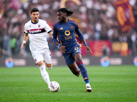 Manu Kone' of AS Roma and Riccardo Orsolini of Bologna FC during the Serie A Enilive match between AS Roma and Bologna FC at Stadio Olimpico...