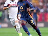 Manu Kone' of AS Roma and Riccardo Orsolini of Bologna FC during the Serie A Enilive match between AS Roma and Bologna FC at Stadio Olimpico...