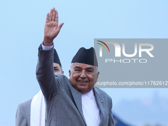 Nepal's President Ram Chandra Paudel waves at the media as he departs for Baku to represent Nepal in COP-29 at the VVIP Terminal of Tribhuva...