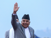 Nepal's President Ram Chandra Paudel waves at the media as he departs for Baku to represent Nepal in COP-29 at the VVIP Terminal of Tribhuva...