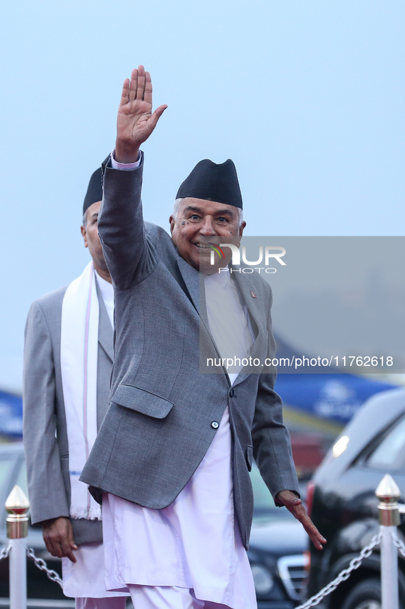 Nepal's President Ram Chandra Paudel waves at the media as he departs for Baku to represent Nepal in COP-29 at the VVIP Terminal of Tribhuva...