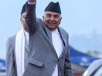 Nepal's President Ram Chandra Paudel waves at the media as he departs for Baku to represent Nepal in COP-29 at the VVIP Terminal of Tribhuva...