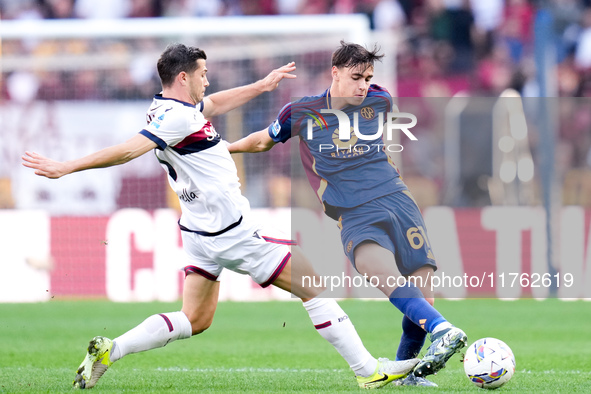 Niccolo' Pisilli of AS Roma and Remo Freuler of Bologna FC compete for the ball during the Serie A Enilive match between AS Roma and Bologna...