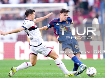 Niccolo' Pisilli of AS Roma and Remo Freuler of Bologna FC compete for the ball during the Serie A Enilive match between AS Roma and Bologna...