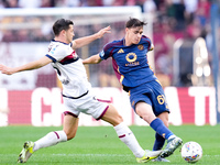 Niccolo' Pisilli of AS Roma and Remo Freuler of Bologna FC compete for the ball during the Serie A Enilive match between AS Roma and Bologna...