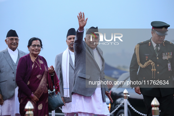 Nepal's President Ram Chandra Paudel (center) waves at the media as he departs for Baku to represent Nepal in COP-29 at the VVIP Terminal of...