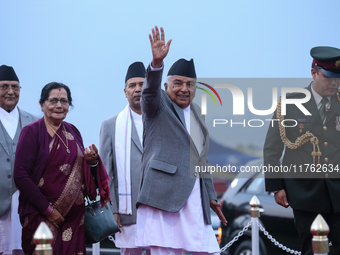 Nepal's President Ram Chandra Paudel (center) waves at the media as he departs for Baku to represent Nepal in COP-29 at the VVIP Terminal of...