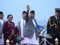 Nepal's President Ram Chandra Paudel (center) waves at the media as he departs for Baku to represent Nepal in COP-29 at the VVIP Terminal of...