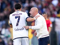 Vincenzo Italiano head coach of Bologna FC gives instructions to Riccardo Orsolini of Bologna FC during the Serie A Enilive match between AS...