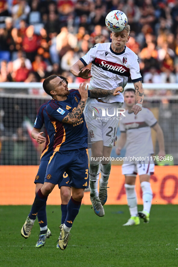 Angelino of A.S. Roma and Jens Odgaard of Bologna F.C. are in action during the 12th day of the Serie A Championship between A.S. Roma and B...