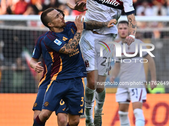 Angelino of A.S. Roma and Jens Odgaard of Bologna F.C. are in action during the 12th day of the Serie A Championship between A.S. Roma and B...