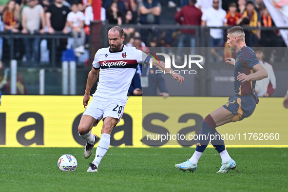 Lorenzo De Silvestri of Bologna F.C. and Artem Dovbyk of A.S. Roma are in action during the 12th day of the Serie A Championship between A.S...