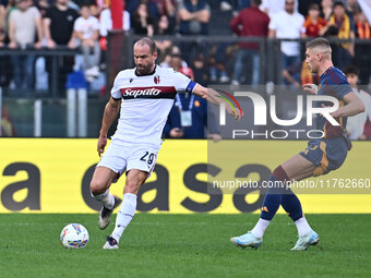 Lorenzo De Silvestri of Bologna F.C. and Artem Dovbyk of A.S. Roma are in action during the 12th day of the Serie A Championship between A.S...