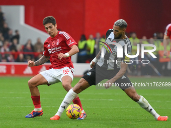 Nicolas Dominguez of Nottingham Forest battles with Joelinton of Newcastle United during the Premier League match between Nottingham Forest...