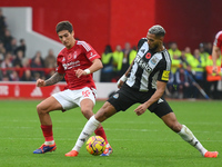 Nicolas Dominguez of Nottingham Forest battles with Joelinton of Newcastle United during the Premier League match between Nottingham Forest...