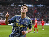 AFC Ajax Amsterdam midfielder Kenneth Taylor celebrates the goal of AFC Ajax Amsterdam forward Bertrand Traore, making the score 2-2, during...