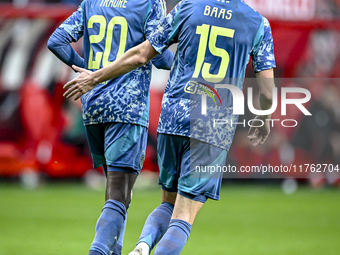 AFC Ajax Amsterdam forward Bertrand Traore and AFC Ajax Amsterdam defender Youri Baas celebrate the 2-2 goal during the match between Twente...