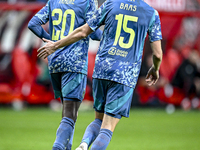 AFC Ajax Amsterdam forward Bertrand Traore and AFC Ajax Amsterdam defender Youri Baas celebrate the 2-2 goal during the match between Twente...