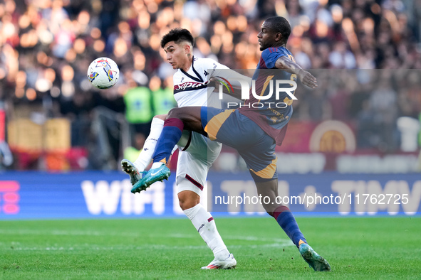 Santiago Castro of Bologna FC and Evan Ndicka of AS Roma compete for the ball during the Serie A Enilive match between AS Roma and Bologna F...