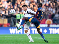 Santiago Castro of Bologna FC and Evan Ndicka of AS Roma compete for the ball during the Serie A Enilive match between AS Roma and Bologna F...