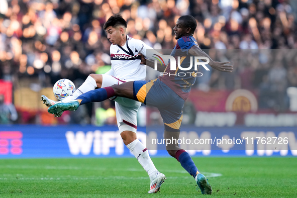 Santiago Castro of Bologna FC and Evan Ndicka of AS Roma compete for the ball during the Serie A Enilive match between AS Roma and Bologna F...