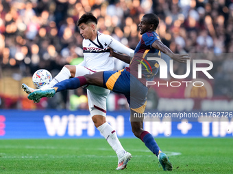 Santiago Castro of Bologna FC and Evan Ndicka of AS Roma compete for the ball during the Serie A Enilive match between AS Roma and Bologna F...