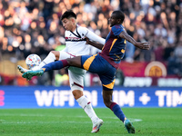 Santiago Castro of Bologna FC and Evan Ndicka of AS Roma compete for the ball during the Serie A Enilive match between AS Roma and Bologna F...