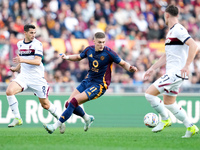 Remo Freuler of Bologna FC and Artem Dovbyk of AS Roma compete for the ball during the Serie A Enilive match between AS Roma and Bologna FC...