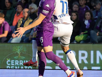 Pietro Comuzzo of ACF Fiorentina and Casper Tengstedt of Hellas Verona FC ,battle for the ball during the Italian Serie A football match bet...