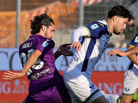 Yacine Adli of ACF Fiorentina and Suat Serdar of Hellas Verona FC ,battle for the ball during the Italian Serie A football match between ACF...