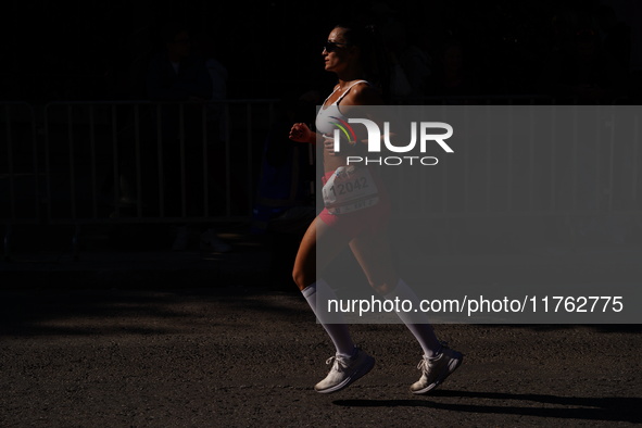 A participant in the Athens Marathon in Athens, Greece, on November 10, 2024, during the race 