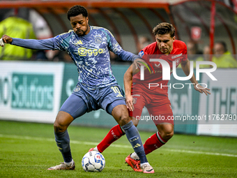 AFC Ajax Amsterdam forward Chuba Akpom and FC Twente defender Bart van Rooij participate in the match between Twente and Ajax at the Grolsch...