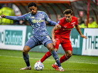 AFC Ajax Amsterdam forward Chuba Akpom and FC Twente defender Bart van Rooij participate in the match between Twente and Ajax at the Grolsch...