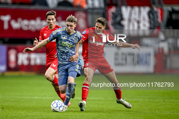 AFC Ajax Amsterdam midfielder Kenneth Taylor and FC Twente midfielder Gijs Besselink play during the match between Twente and Ajax at the Gr...