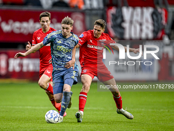 AFC Ajax Amsterdam midfielder Kenneth Taylor and FC Twente midfielder Gijs Besselink play during the match between Twente and Ajax at the Gr...