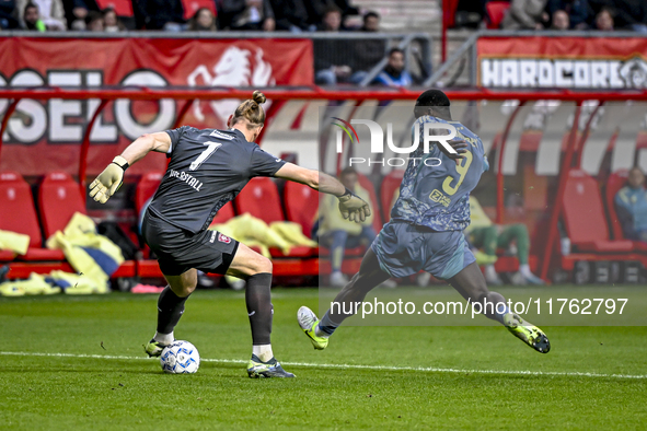 FC Twente goalkeeper Lars Unnerstall and AFC Ajax Amsterdam forward Brian Brobbey play during the match between Twente and Ajax at the Grols...