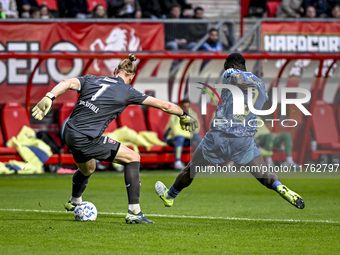 FC Twente goalkeeper Lars Unnerstall and AFC Ajax Amsterdam forward Brian Brobbey play during the match between Twente and Ajax at the Grols...