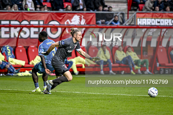 FC Twente goalkeeper Lars Unnerstall and AFC Ajax Amsterdam forward Brian Brobbey play during the match between Twente and Ajax at the Grols...