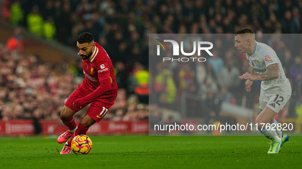 Liverpool's Mohamed Salah is in action with Aston Villa's Lucas Digne during the Premier League match between Liverpool and Aston Villa at A...