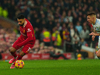 Liverpool's Mohamed Salah is in action with Aston Villa's Lucas Digne during the Premier League match between Liverpool and Aston Villa at A...