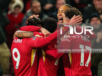 Darwin Nunez celebrates with his teammates after scoring their first goal during the Premier League match between Liverpool and Aston Villa...