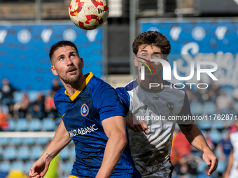 Players are in action during the Primera RFEF 2024-2025 match between FC Andorra and Barakaldo CF at Estadi Nacional in Andorra La Vella, An...