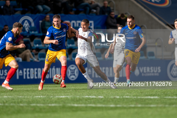 Players are in action during the Primera RFEF 2024-2025 match between FC Andorra and Barakaldo CF at Estadi Nacional in Andorra La Vella, An...