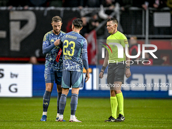 AFC Ajax Amsterdam midfielder Jordan Henderson, AFC Ajax Amsterdam forward Steven Berghuis, and referee Allard Lindhout participate in a mat...