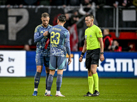 AFC Ajax Amsterdam midfielder Jordan Henderson, AFC Ajax Amsterdam forward Steven Berghuis, and referee Allard Lindhout participate in a mat...